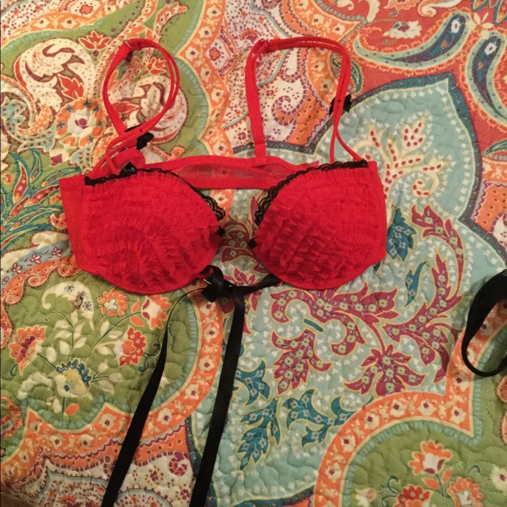 Red and black lace bra. Black ribbon tie.